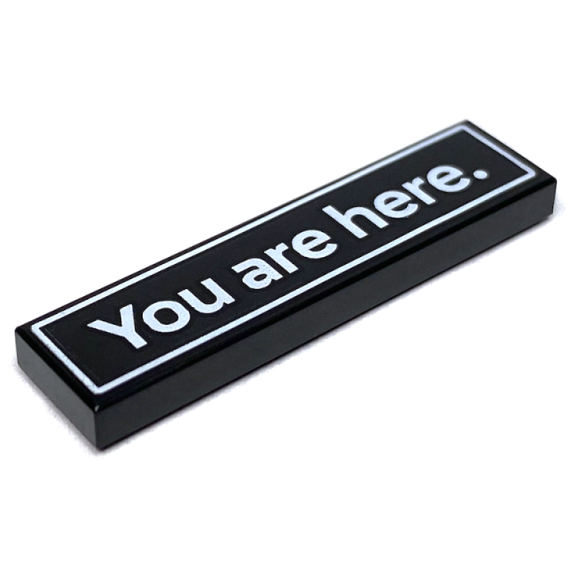 Tegel 1x4 met 'You are here.' opdruk Black